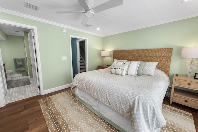 bedroom with ornamental molding, visible vents, baseboards, and wood finished floors