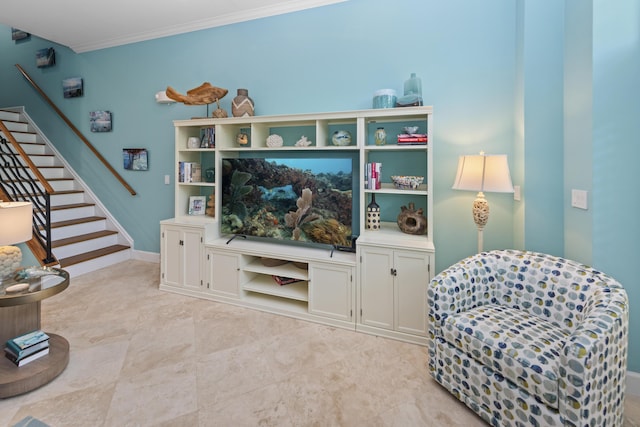 sitting room featuring crown molding, stairway, and baseboards