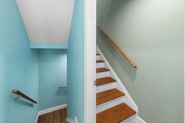 stairs with baseboards and wood finished floors