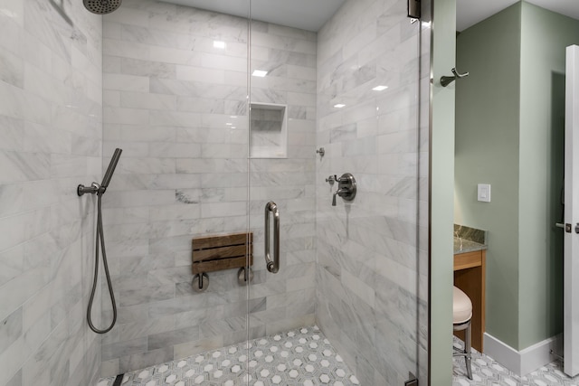 full bath featuring a stall shower and vanity