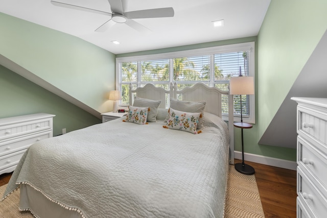 bedroom with a ceiling fan, baseboards, and dark wood-style flooring