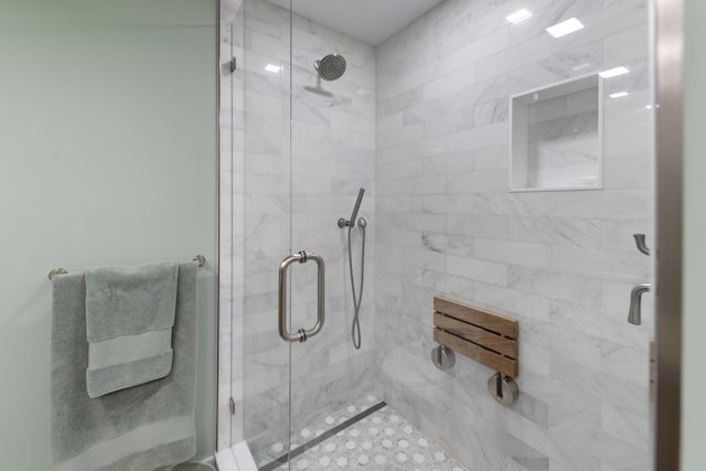 bathroom featuring a shower stall