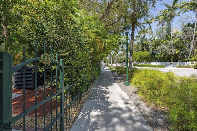 view of community featuring fence