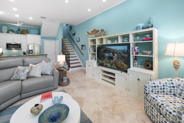 living room featuring recessed lighting, crown molding, and stairway