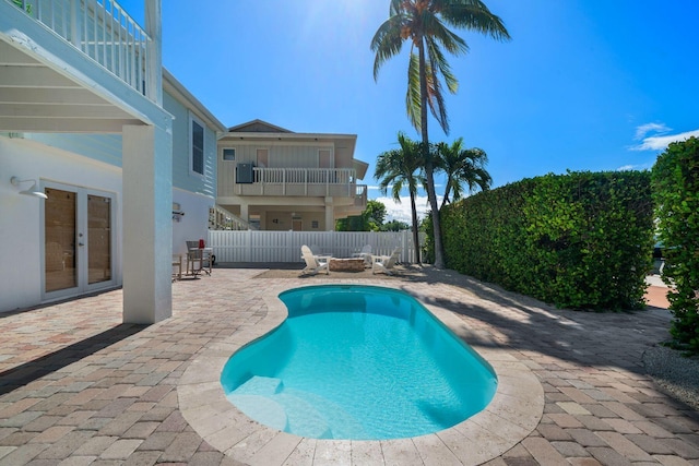 view of pool with a patio area and french doors