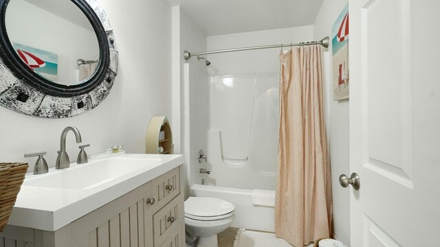 full bathroom featuring vanity, shower / bathtub combination with curtain, and toilet