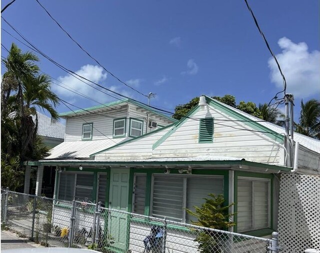 720-726 Emma St, Key West, FL 33040 - view of front of property with a porch and a fenced front yard