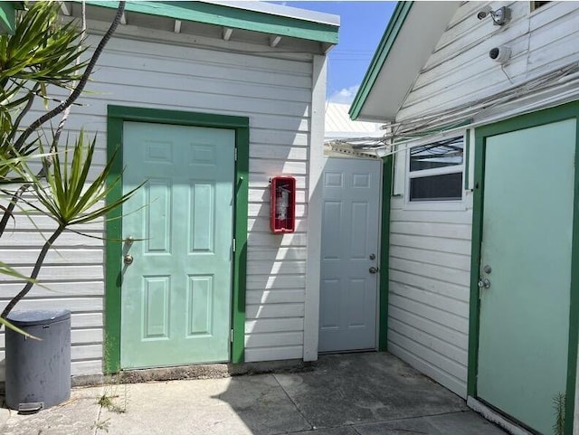 720-726 Emma St, Key West, FL 33040 - view of exterior entry with a metal roof