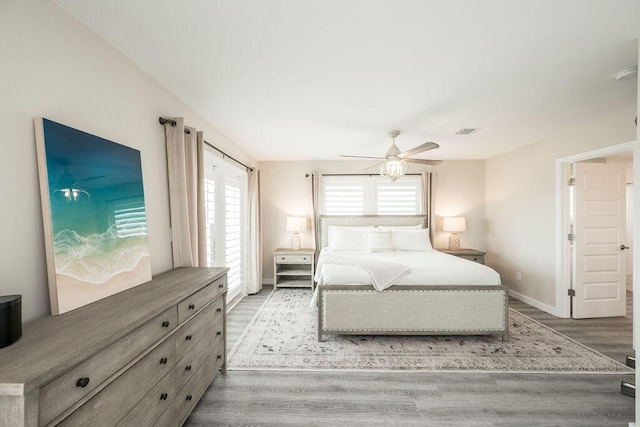 bedroom featuring hardwood / wood-style flooring and ceiling fan