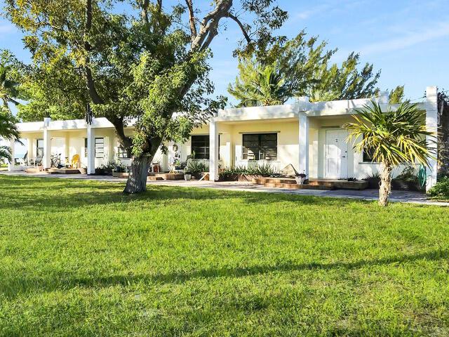 view of front of home with a front lawn