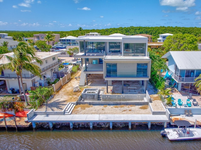 16 S Exuma Rd, Key Largo, FL 33037 - rear view of property featuring a balcony and a water view