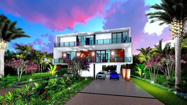 16 S Exuma Rd, Key Largo, FL 33037 - back of house at dusk featuring a carport, a balcony, driveway, and stucco siding