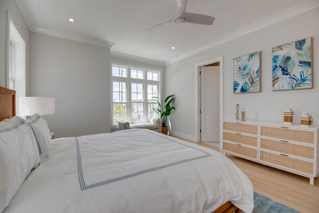 bedroom with ceiling fan, ornamental molding, and hardwood / wood-style floors