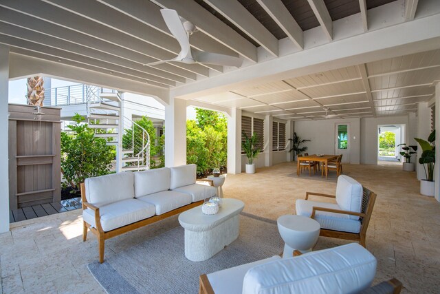 view of patio featuring ceiling fan and outdoor lounge area