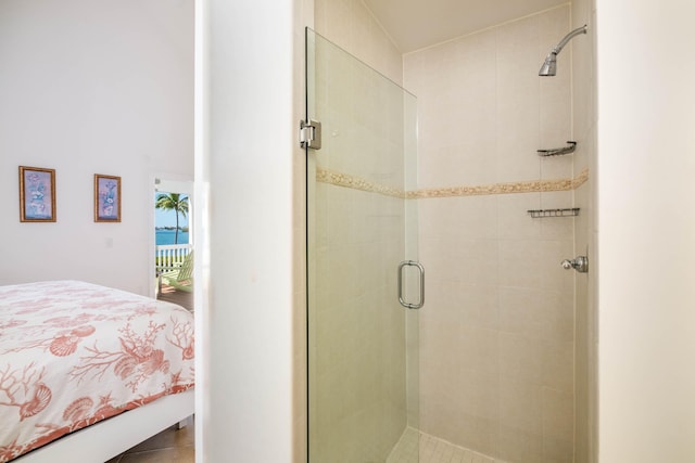 bathroom featuring a shower with door