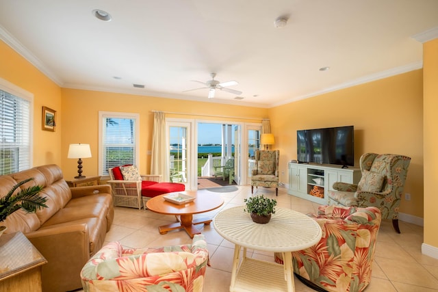 living room with crown molding, light tile patterned floors, and ceiling fan