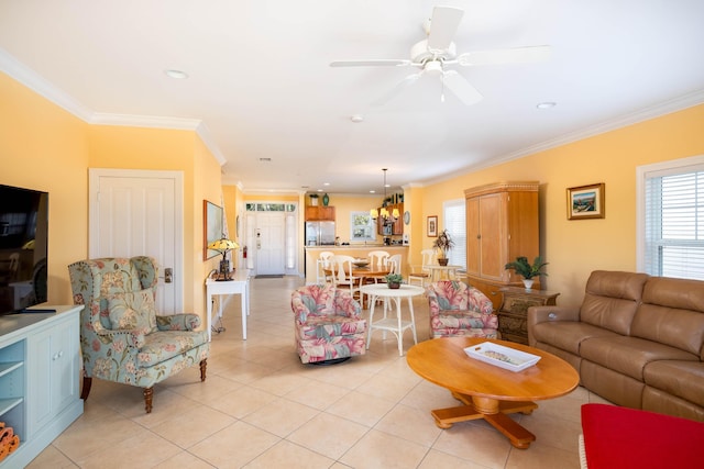 living room with crown molding, ceiling fan, and light tile patterned flooring