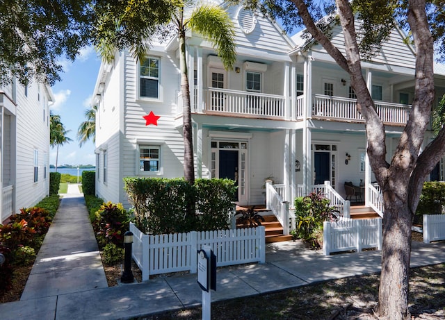 view of front of house featuring a balcony