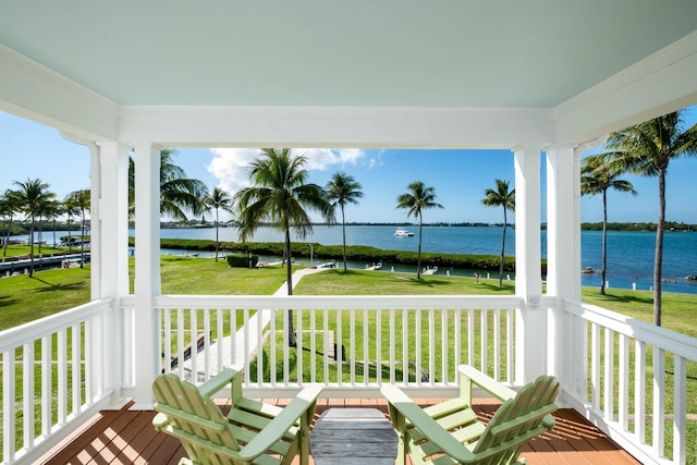 deck featuring a water view and a yard