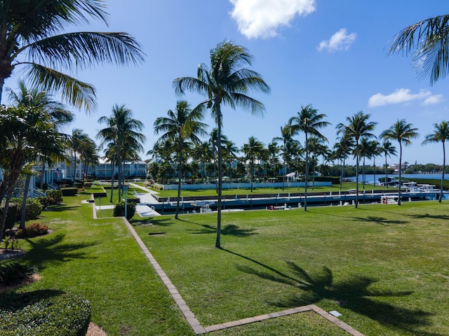 view of home's community featuring a yard and a water view