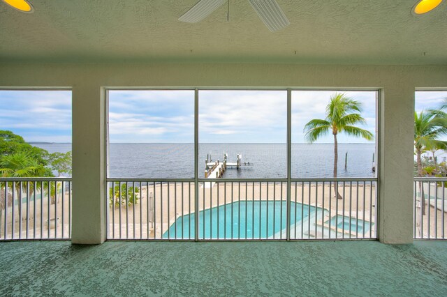 unfurnished sunroom featuring vaulted ceiling, french doors, and ceiling fan