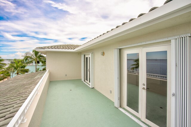 view of front of home with a carport and a balcony