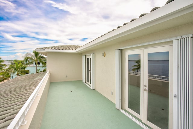 view of patio / terrace featuring a balcony and french doors