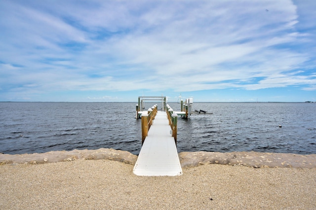 view of dock featuring boat lift and a water view