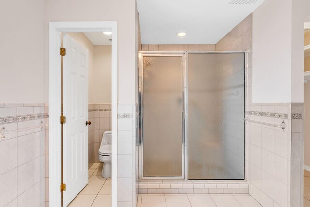 carpeted empty room featuring ceiling fan and french doors