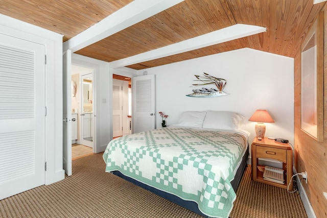 bedroom with lofted ceiling with beams, carpet floors, and wood ceiling