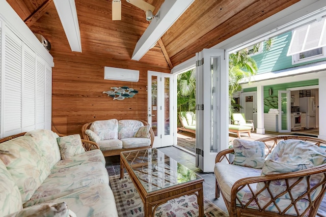 living area with lofted ceiling with beams, wooden ceiling, wooden walls, and a wall mounted AC