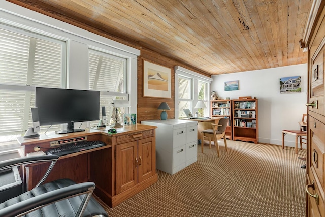 home office with light carpet, wood ceiling, and baseboards