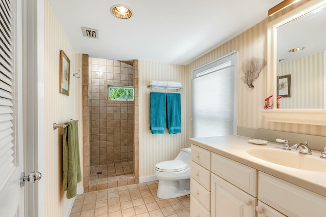 bathroom with toilet, wallpapered walls, visible vents, and tile patterned floors