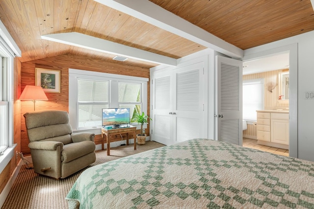 bedroom with vaulted ceiling with beams, light colored carpet, visible vents, wood ceiling, and wood walls