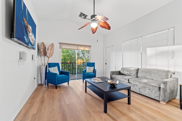 living room featuring lofted ceiling, hardwood / wood-style floors, and ceiling fan