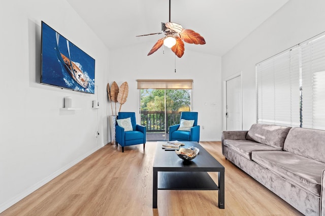 living room with wood-type flooring, lofted ceiling, and ceiling fan