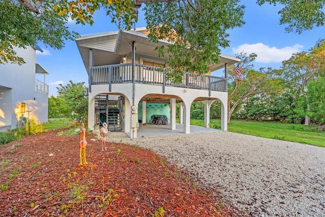 back of property with a carport