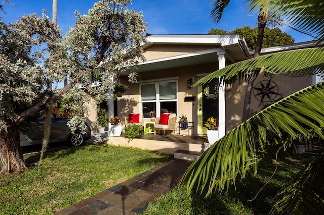 back of house featuring a yard