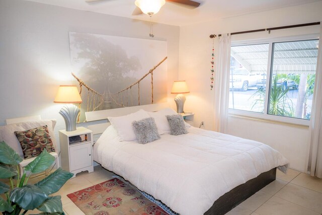 bedroom featuring light tile patterned flooring and ceiling fan