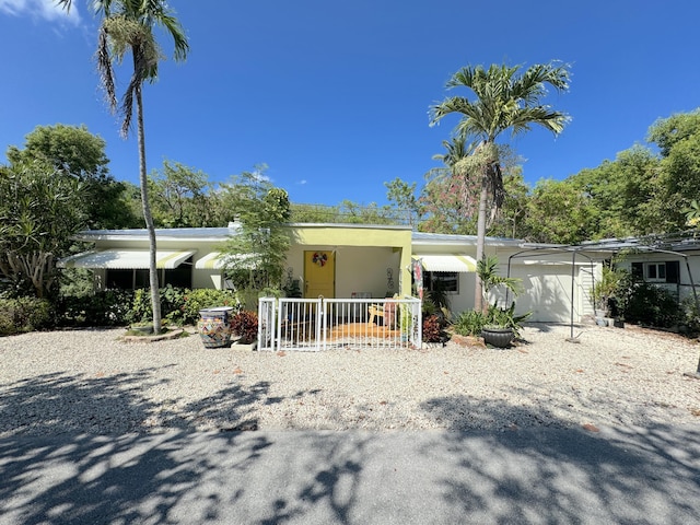 view of front of house featuring a garage and covered porch