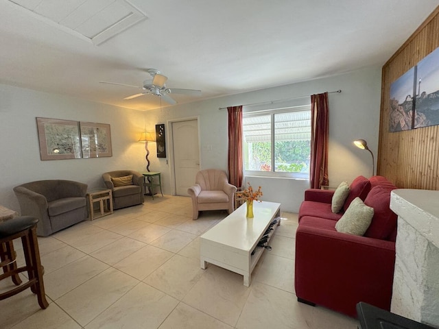 tiled living room featuring ceiling fan