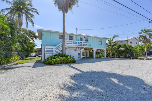 raised beach house with a carport