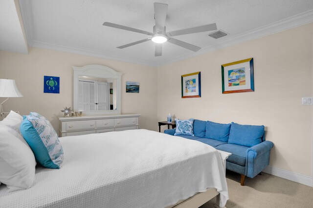 bedroom with ornamental molding, light colored carpet, and ceiling fan