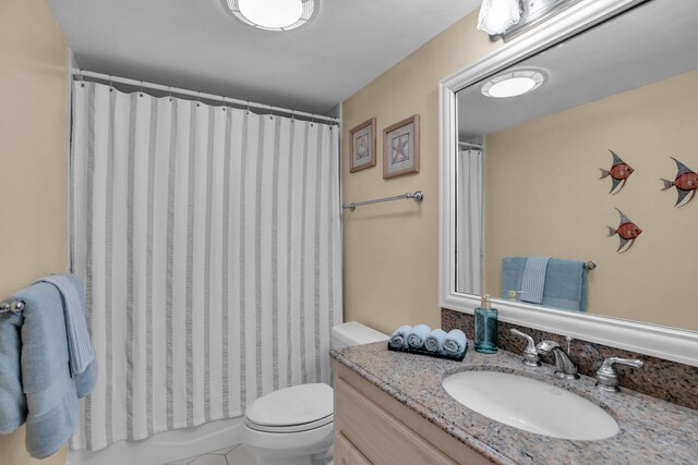 full bathroom featuring vanity, toilet, and shower / bath combo with shower curtain