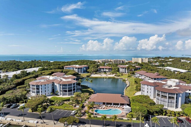 drone / aerial view featuring a water view