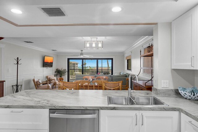 kitchen featuring dishwasher, sink, white cabinets, and crown molding