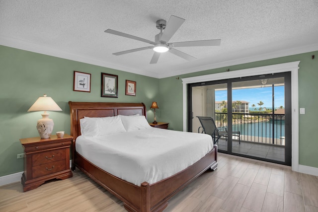 88181 Old Hwy Unit 21H, Islamorada, FL 33036 - bedroom with crown molding, light hardwood / wood-style flooring, ceiling fan, access to exterior, and a textured ceiling