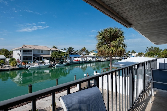 balcony featuring a water view