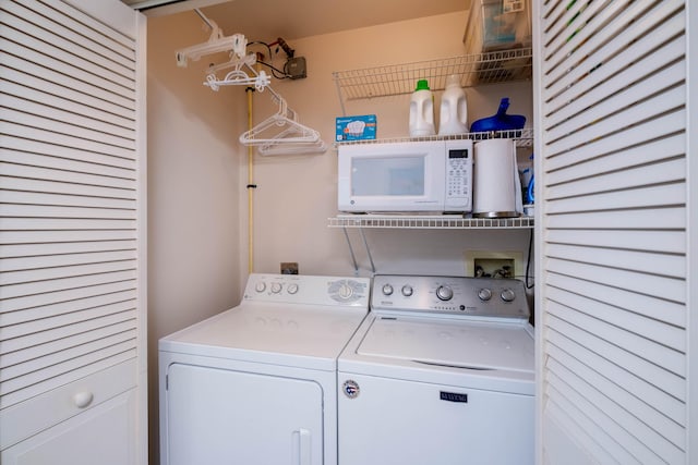 washroom featuring independent washer and dryer