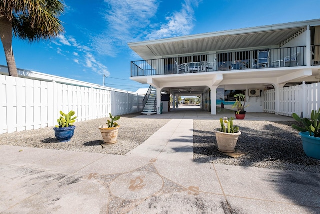 rear view of property with a carport